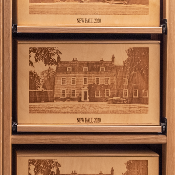 front of an engraved wine case